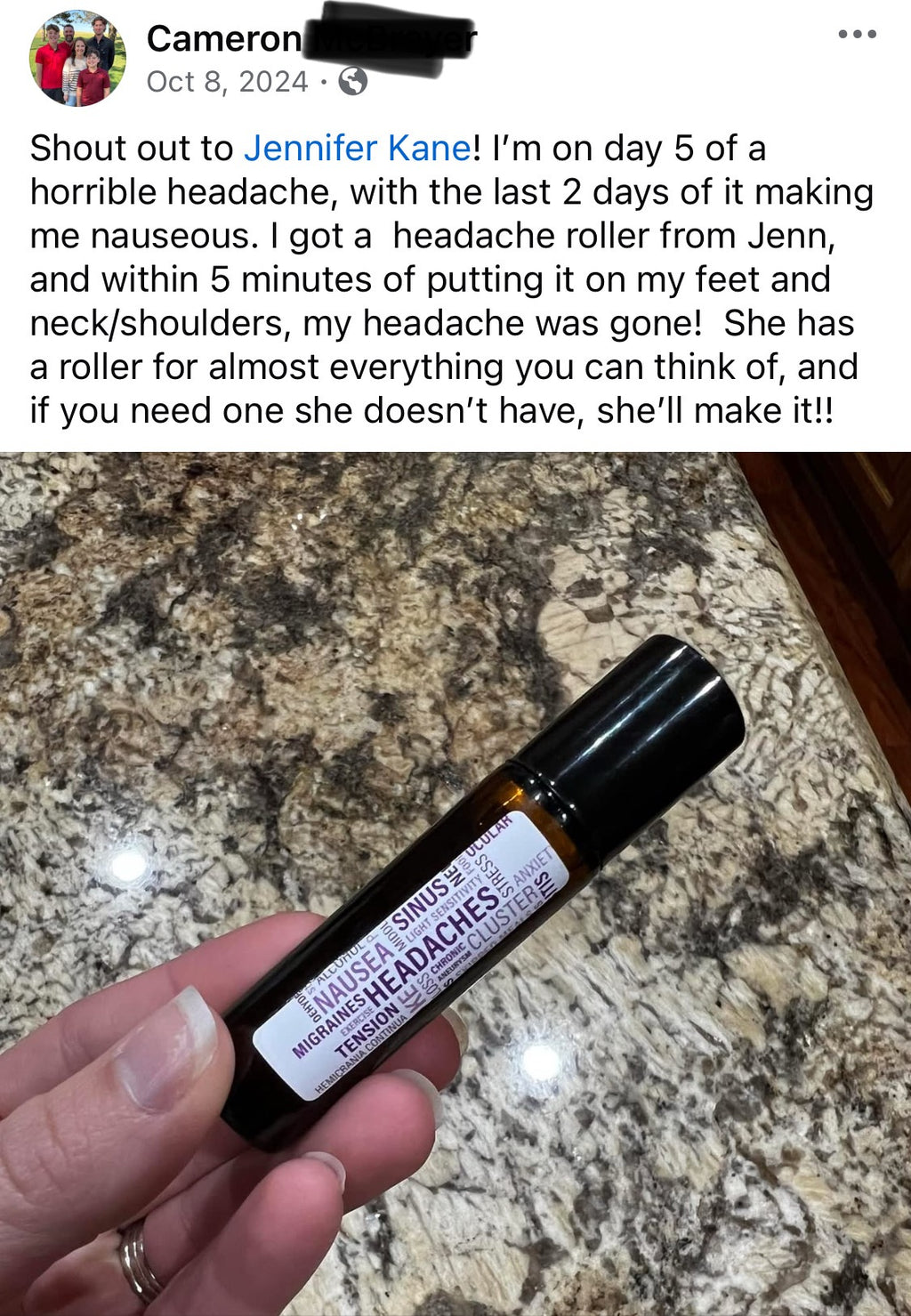 Hand holding a headache roller with a marble countertop background and post talking about it stopping her migraine. 