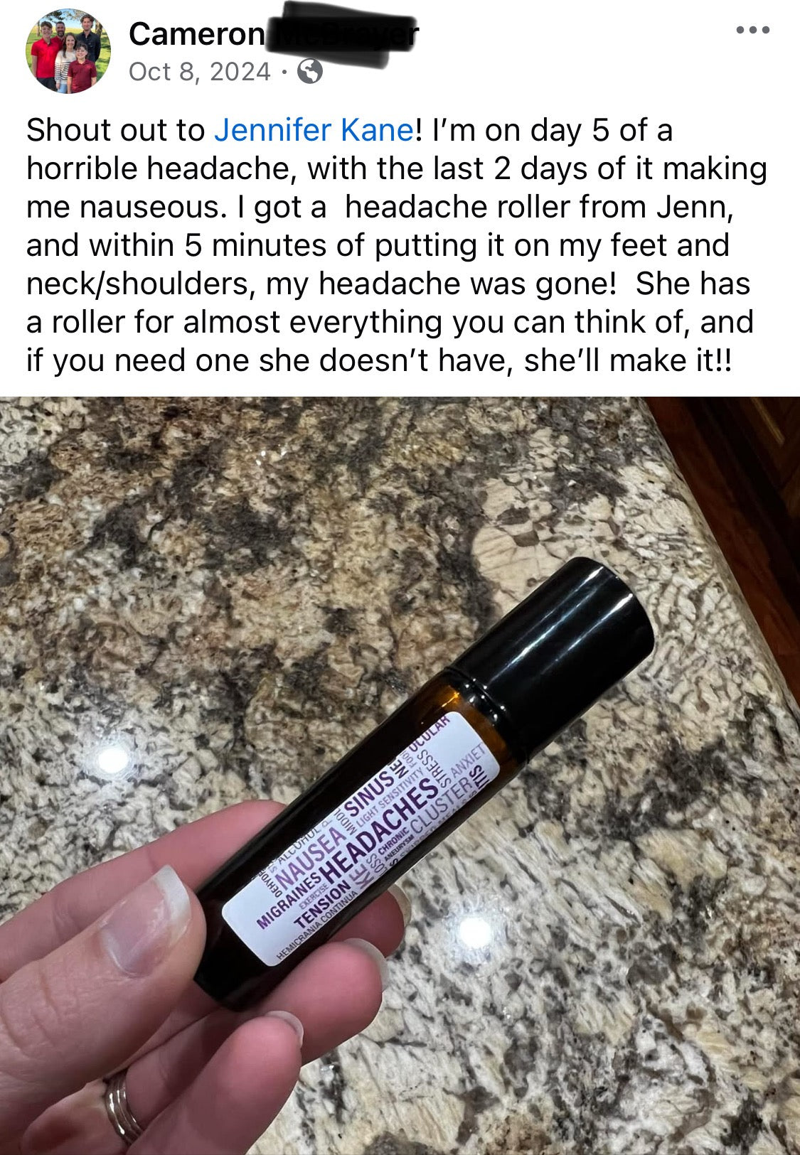 Hand holding a headache roller with a marble countertop background and post talking about it stopping her migraine. 